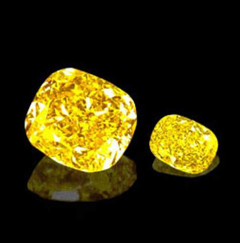 The 101.28-carat Golden Star diamond and its 16.63-carat satellite sister diamond, both cushion-cut and fancy vivid yellow