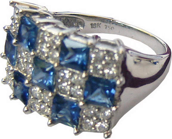 Rectangular ring with three rows lengthwise and five rows breadthwise,consisting of alternating blue sapphires and diamonds.