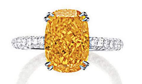 4.19-carat, cushion-cut, fancy vivid orange diamond set in a ring