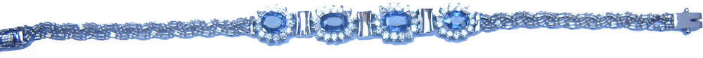 Half round cluster bracelet with Ceylon (Sri Lanka) blue sapphires and diamonds set in 18ct white gold.