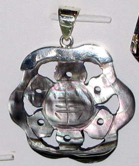 A Carved Abalone Eardrop
