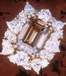 dark-coloured-champagne-emerald-cut-jewel-contrasted-with-white-diamonds