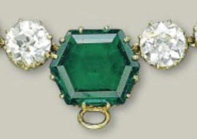 The central large hexagonal emerald with a loop for the Andean Cross 