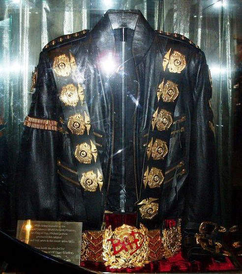 Michael Jackson's original Jacket and Belt worn in the music video "Bad". The jacket and belt are emblazoned with 12 pounds of 24-karat gold and crystal decorations.