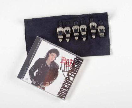 Lot No. 327: Michael Jackson Bad costume piece and signed CD