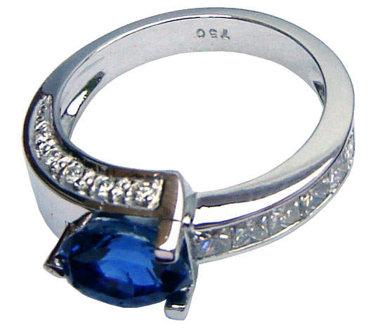 Ring of unique design with Ceylon (Sri Lanka)blue sapphire and diamonds set in white gold.