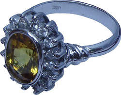 Cluster ring with an attractive design made up of a large Ceylon(Sri Lanka) yellow sapphire and diamonds set in 18ct white gold.