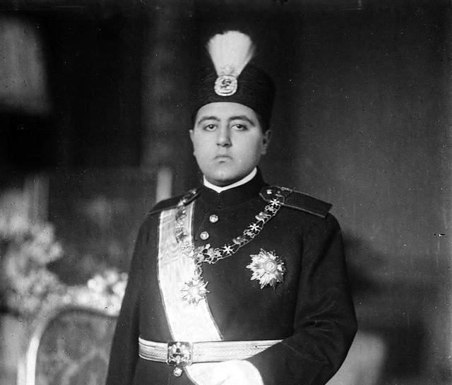 Sultan Ahmed Shah Qajar wearing the fancy yellow diamond brooch affixed to an aigrette
