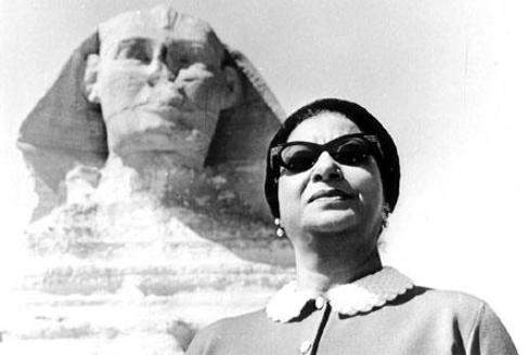 Umm Kulthum standing opposite the Sphinx in Egypt