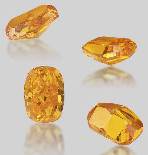 Various views of the unmounted 4.19-carat, fancy vivid orange diamond 