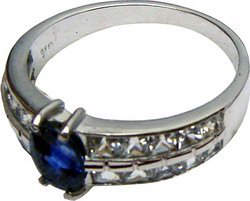 Ring of unique design with a large Ceylon(Sri Lanka) blue sapphire and diamonds set in 18 ct white gold.